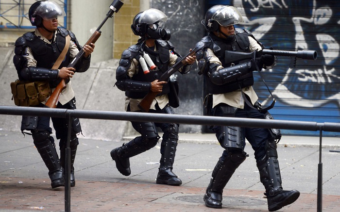 Venezuelan police seal off parliament, four MPs accused of treason